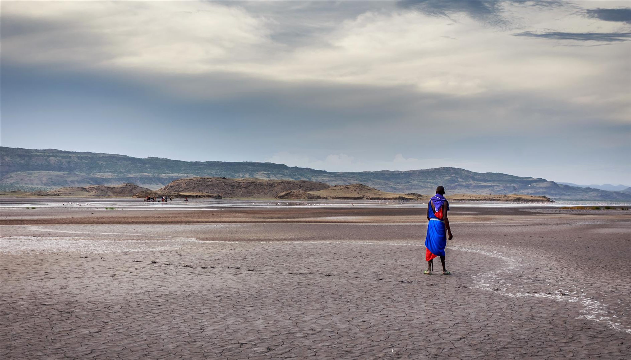 maasai_standing_dried_natron_lake_loliondo_game_controlled_area_tanzania Dramatic scenes of Lake Natron in Tanzania